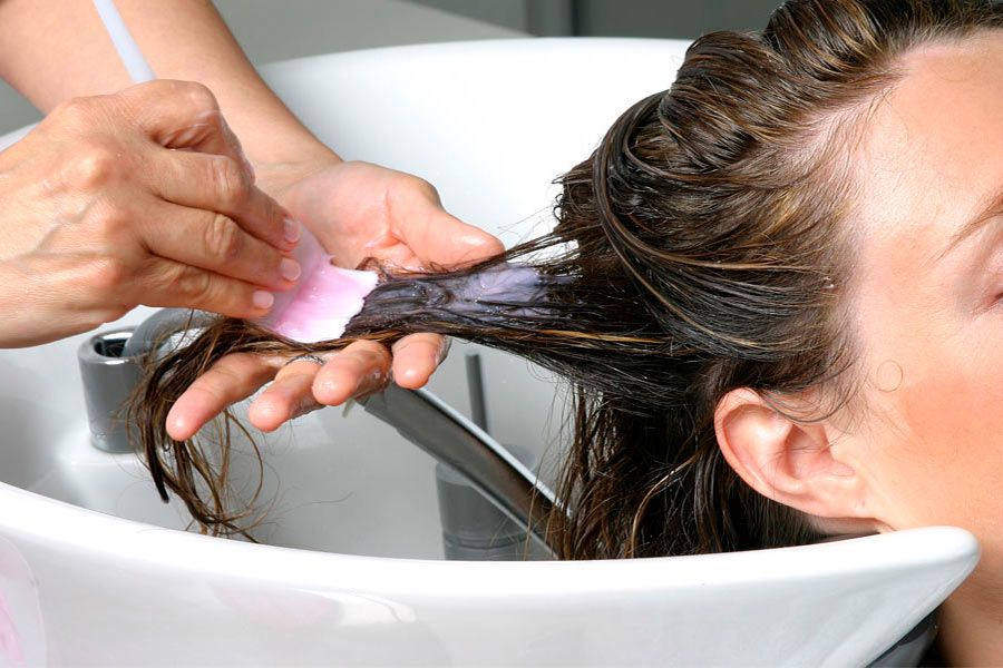 Applying hairdressing coloring products.